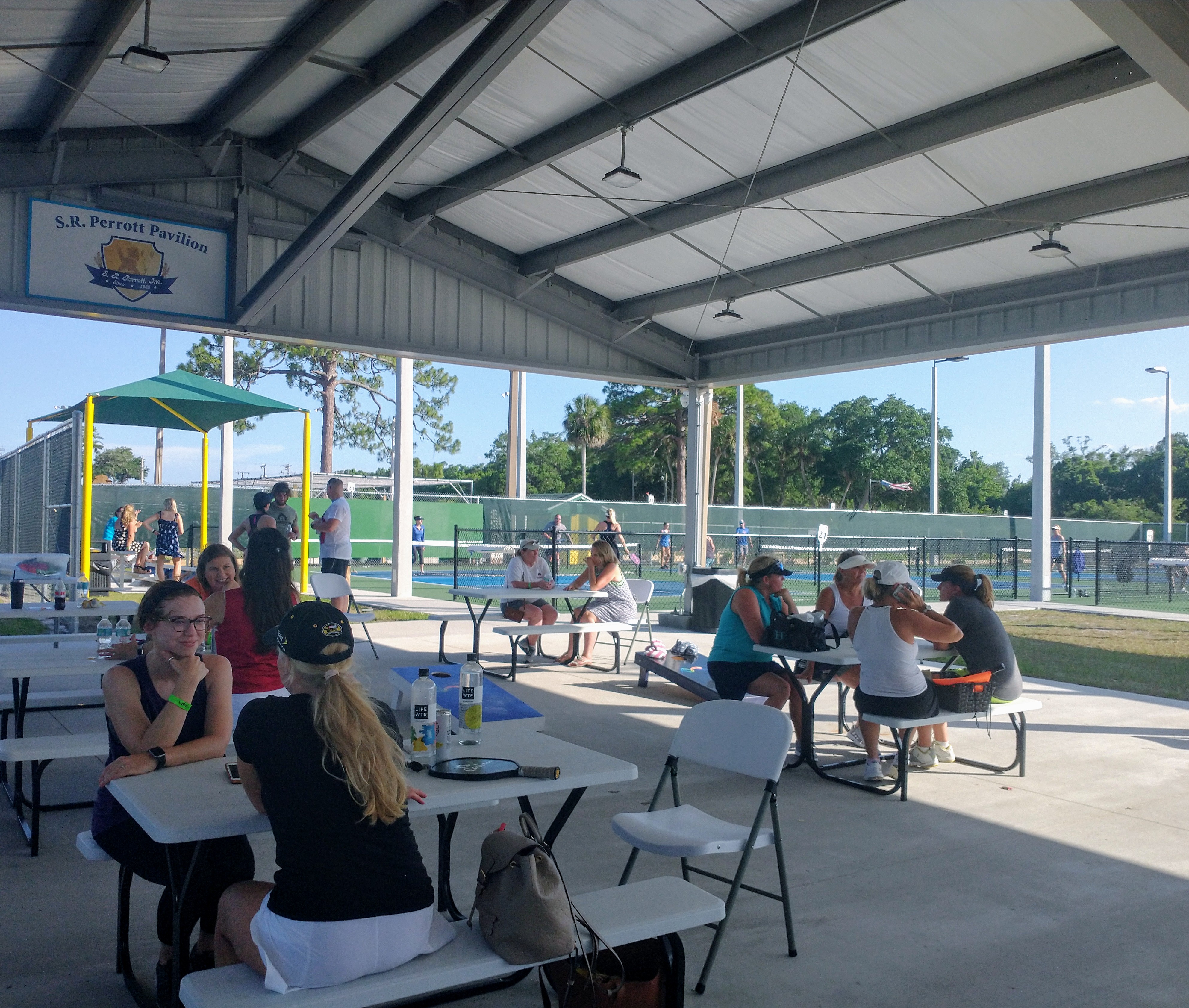 Guests gathering for a partner event in a covered Pictona pavilion